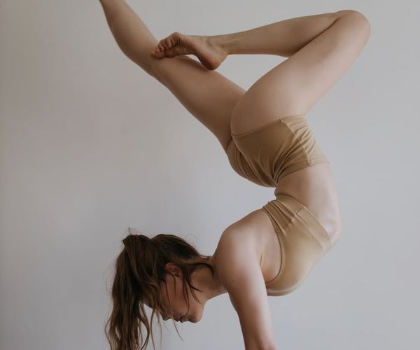 Athlete balancing on one leg, showing core strength and focus.